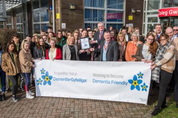 B58A9248-2 Staff and students outside holding Dementia Banner