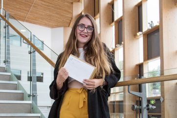 Chelsea-Marie-Annett-18-Ebbw-Vale-3 student holding results on campus stairs