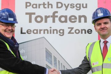Guy-and-Anthony-with-Torfaen-new-name Principal in front of TLZ hoarding