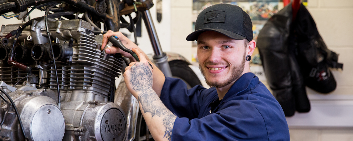 ATA man working on a car engine