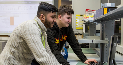 Career Colleges - Digital 2 students on a computer