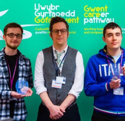 Two Coleg Gwentstudents, proudly showcasing their trophies.