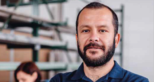 pla-toolkit Man with beard in blue polo shirt