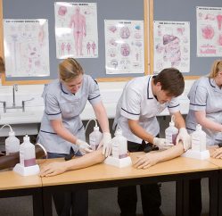 Healthcare learners using training arms