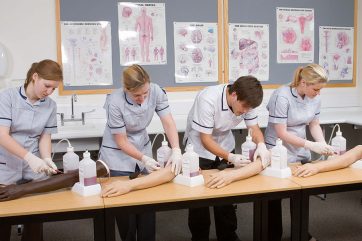 health-care-career-colleges-main Healthcare learners using training arms