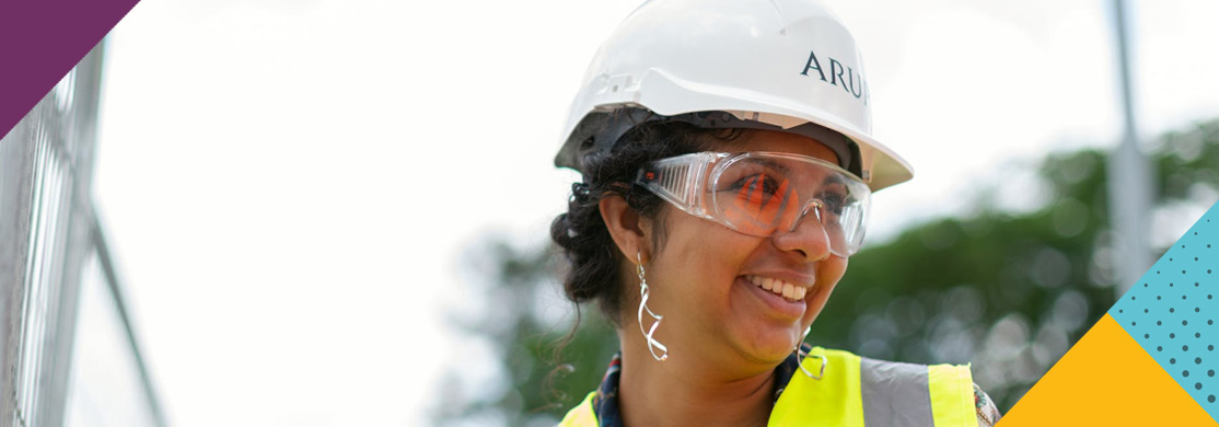health-safety-sector-header Woman in hard hat, hi-vis and safety glasses