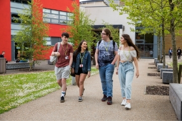 Starting college - Coleg Gwent learners walking outside Crosskeys campus