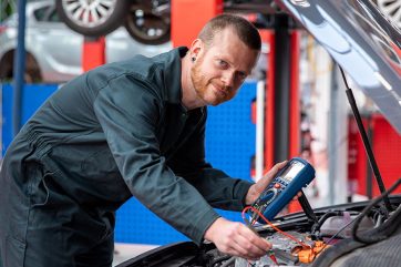 Adult-Learner-Kai-Griffiths-social Man working under car bonnet