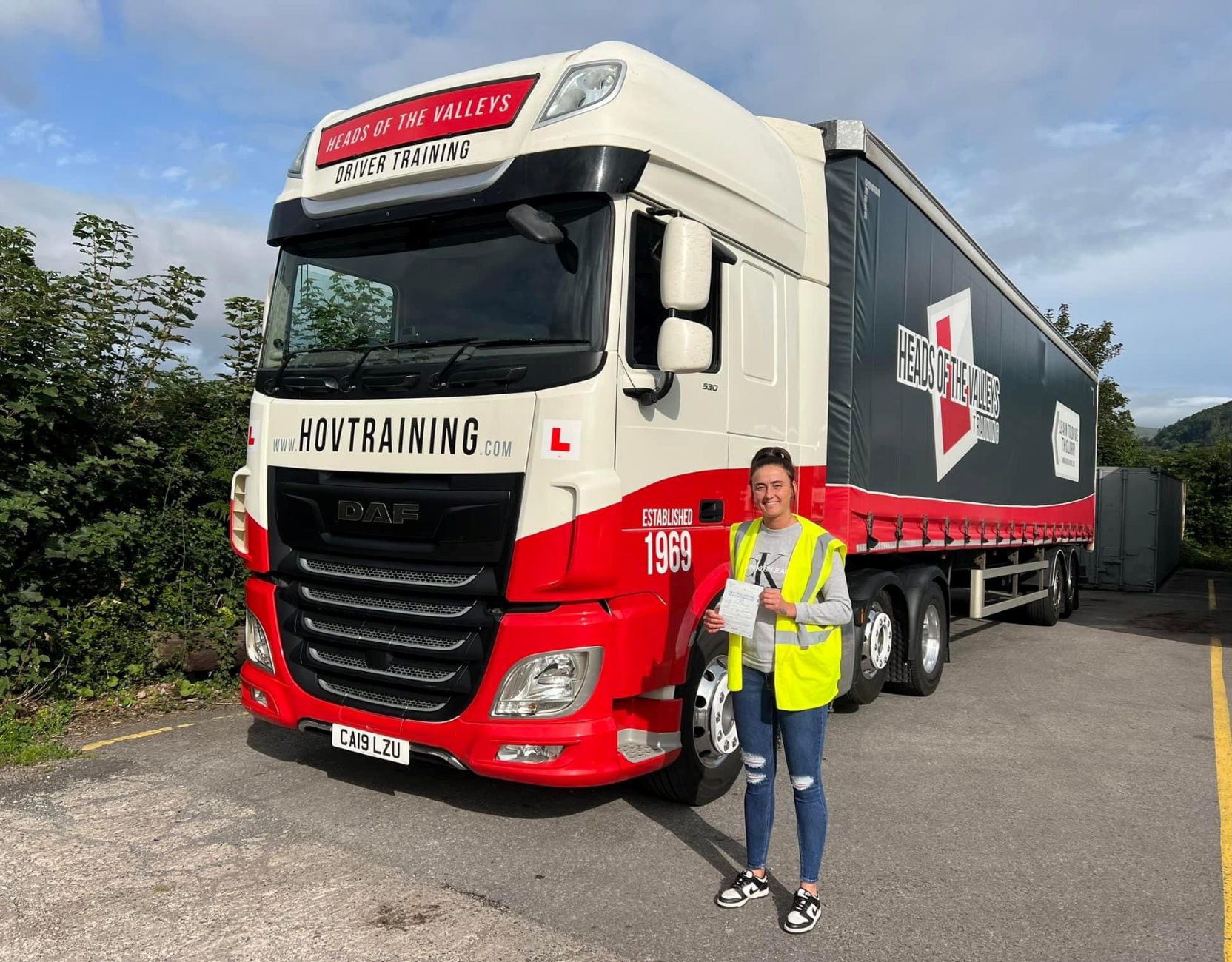 Lady next to HGV lorry