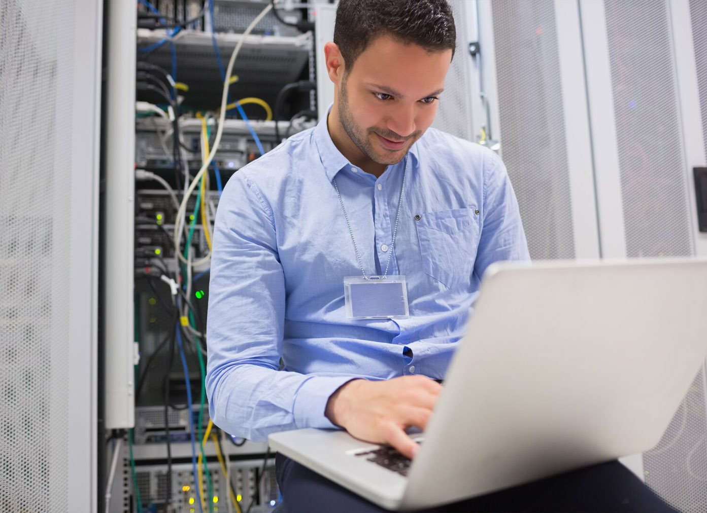 Networking engineer using a laptop