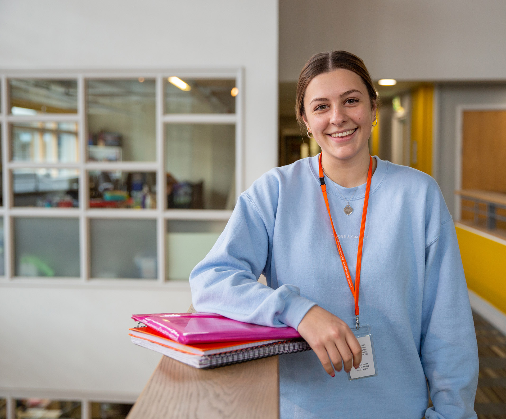 Mia on campus with books