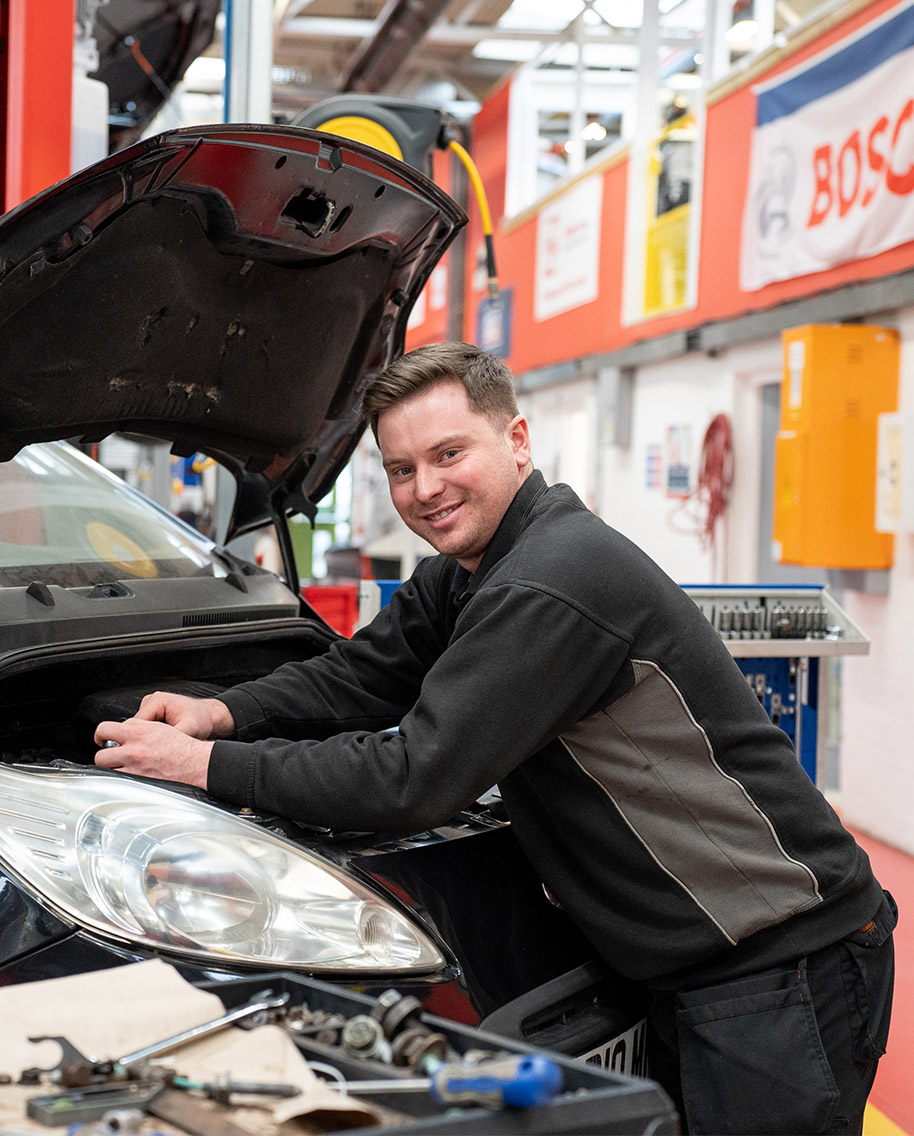 Automotive student working on car