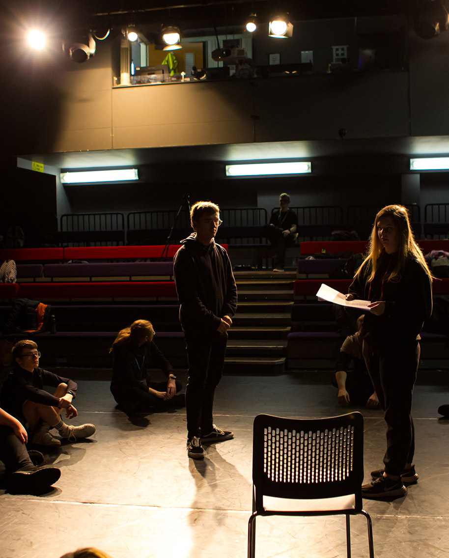 Learners performing on stage