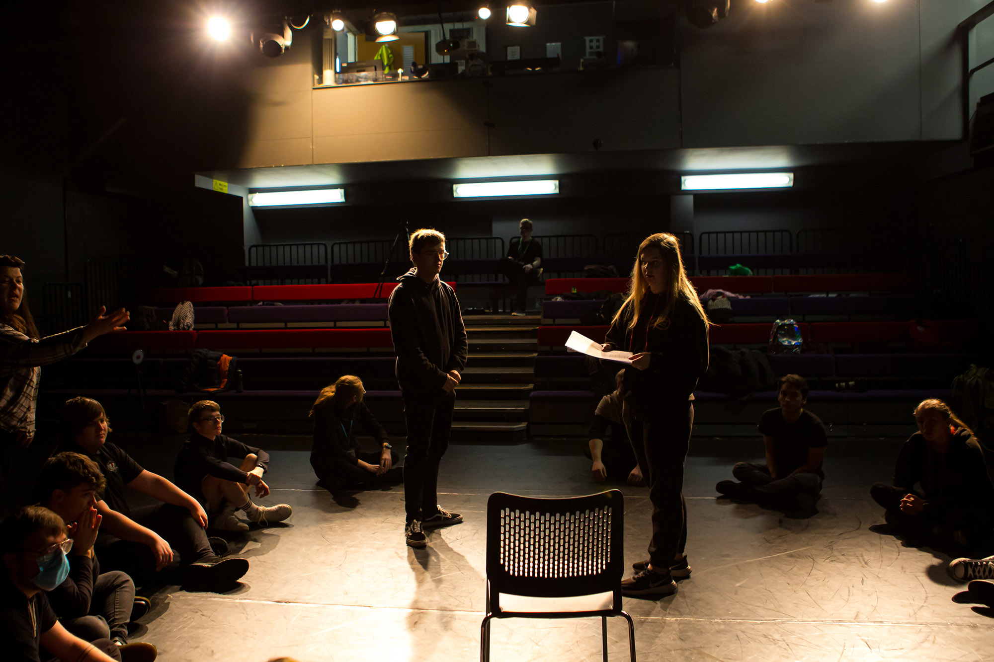 Learners performing on stage