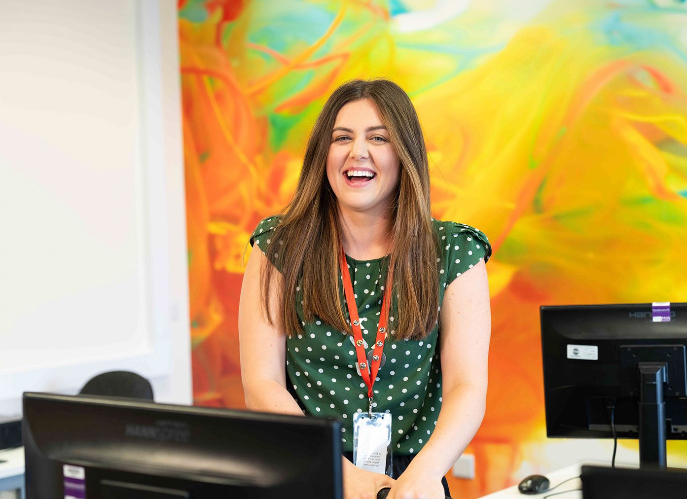 Member of staff laughing