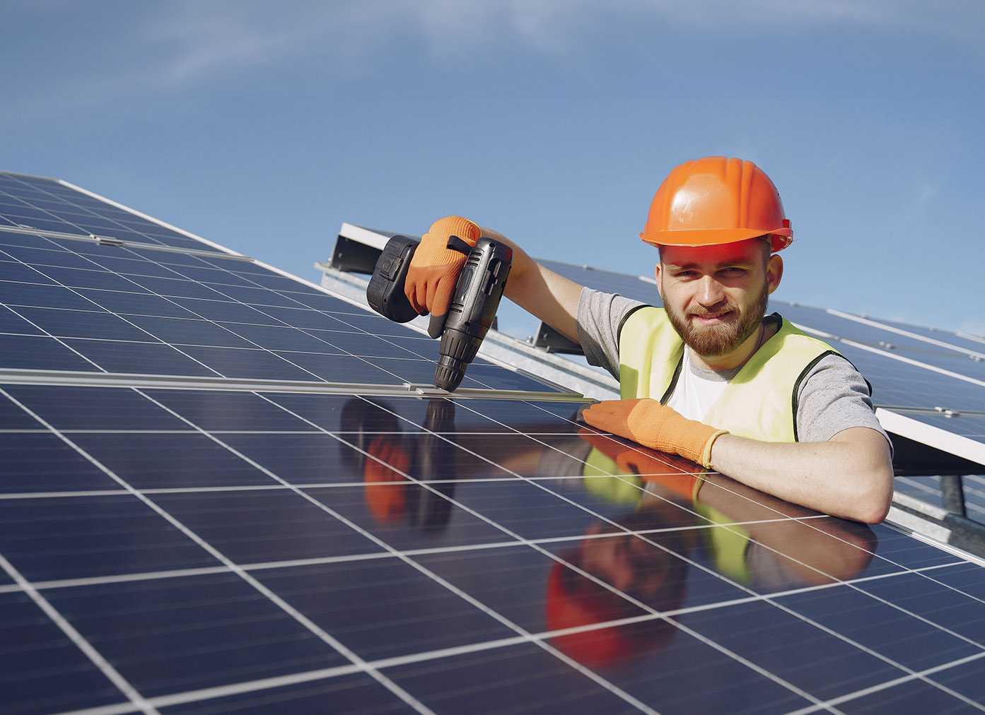 Man working on solar panels