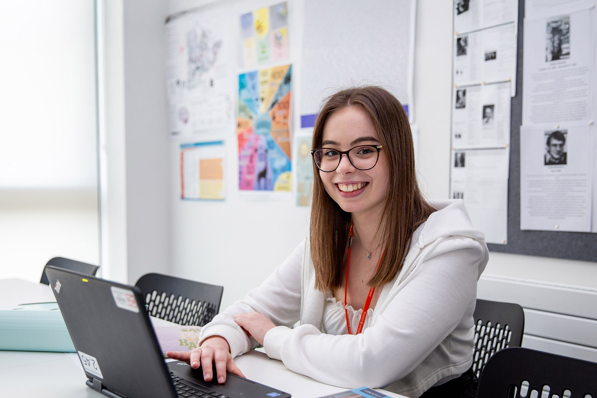 A level student using a laptop in class
