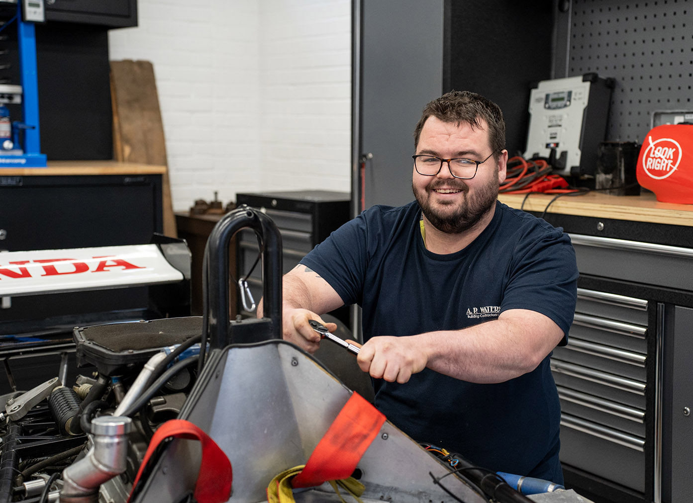 Apprentice working on a race car