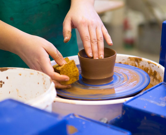 Pottery wheel with clay