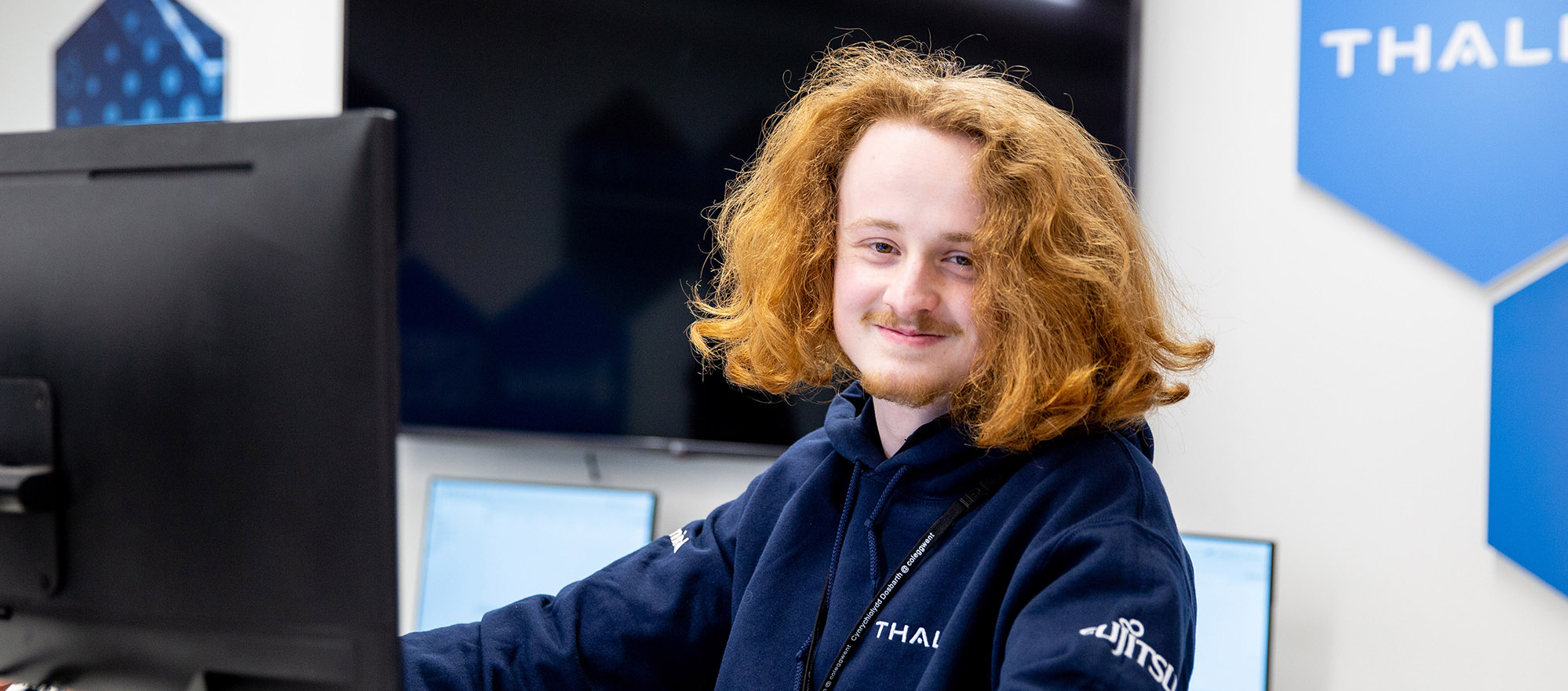 Student sat at a computer in class
