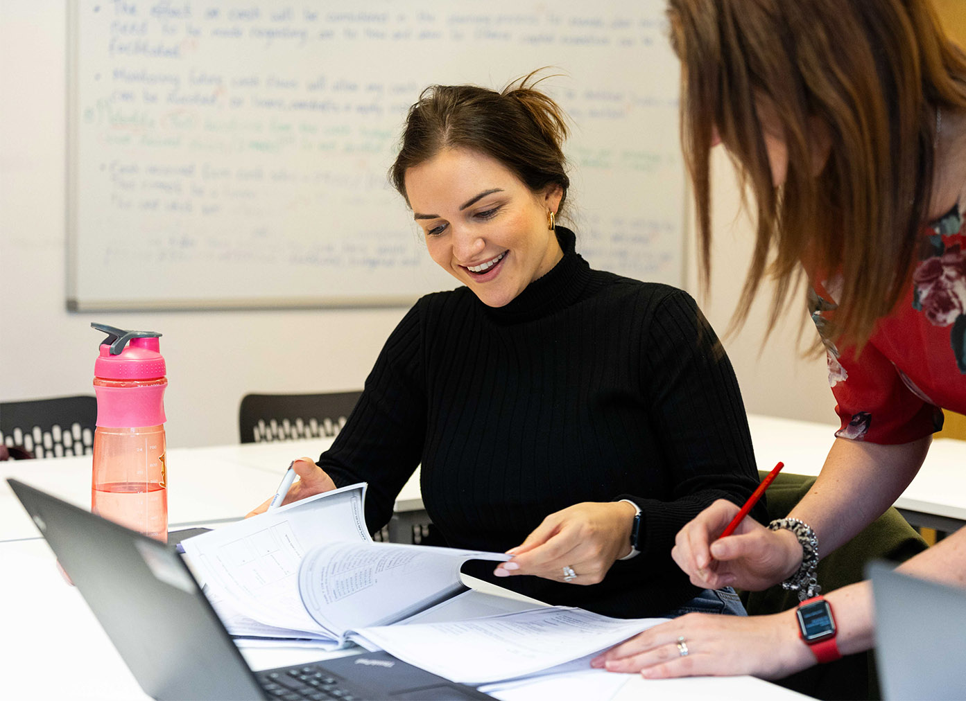 Accounting student in class with tutor