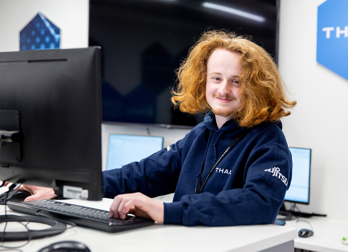 Computing student sat in the Cyber Hub at BGLZ