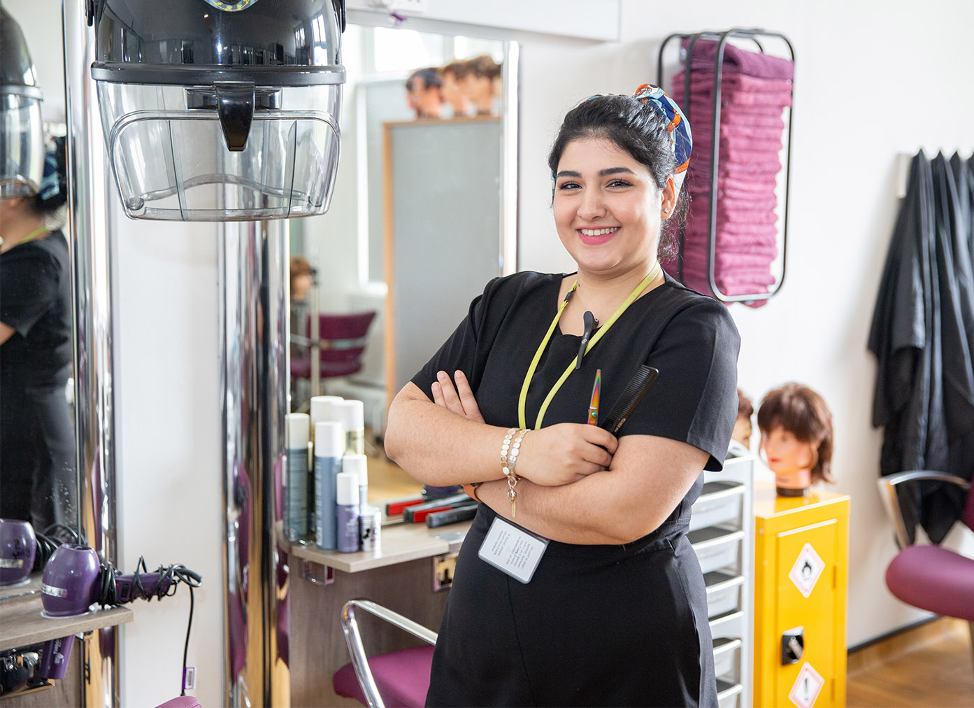 Hairdressing student smiling in a salon