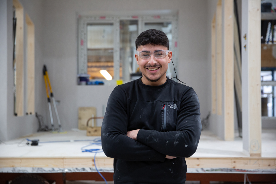 Student smiling in workshop