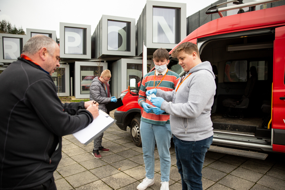 Students talking to tutor and police