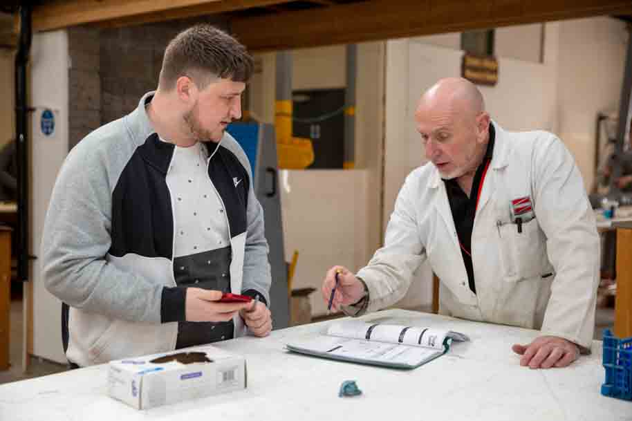 Tutor walking through papers