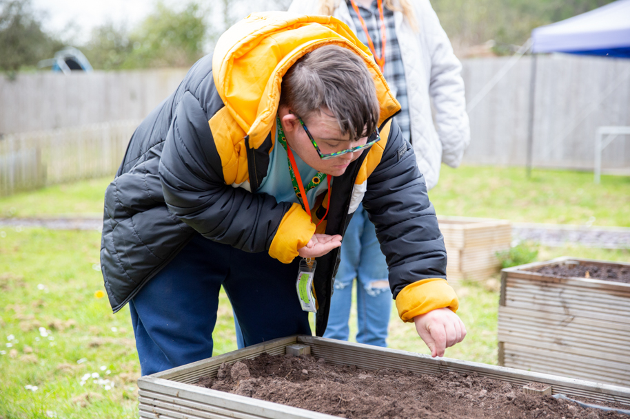Student working on. the flowerbed