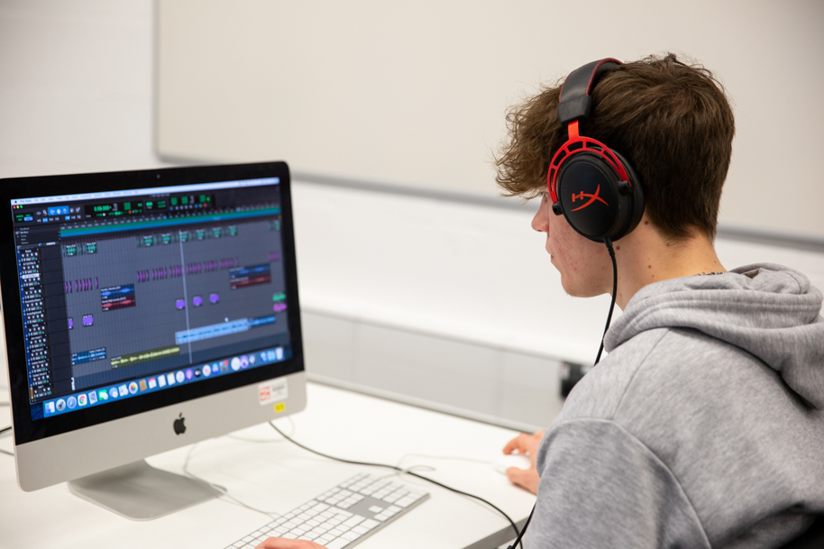 Student using editing software on mac