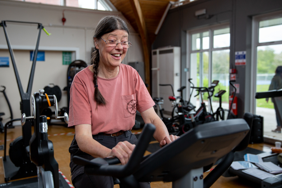 Mature student working out on treadmill