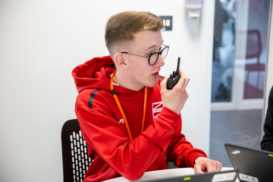Public Services student on walkie talkie