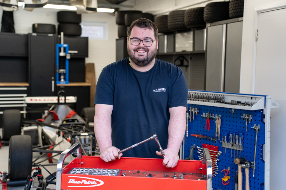 Student holding toolbox