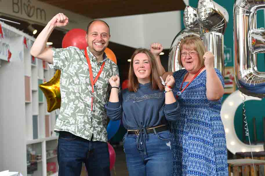 Student and tutors celebrating A Level results