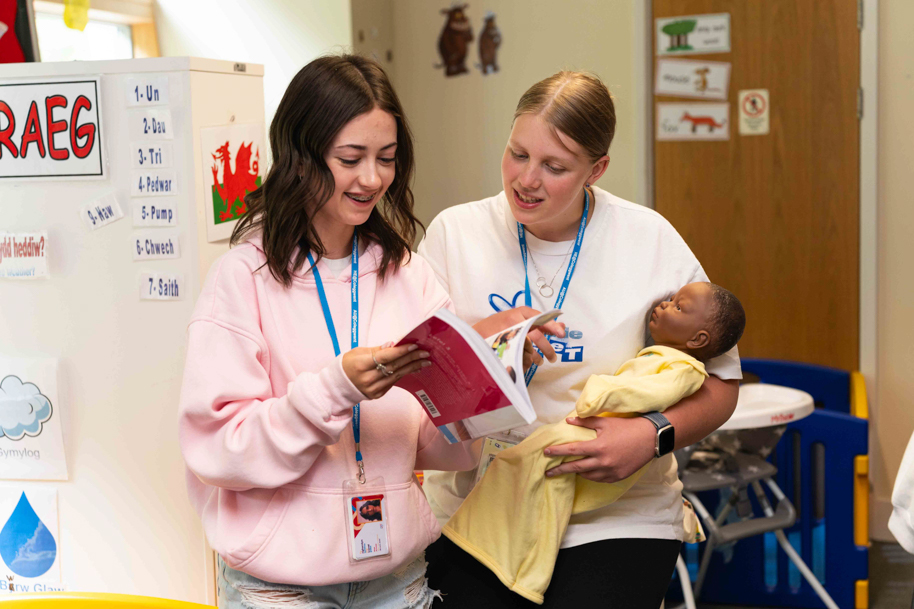 Childcare students laughing and working together