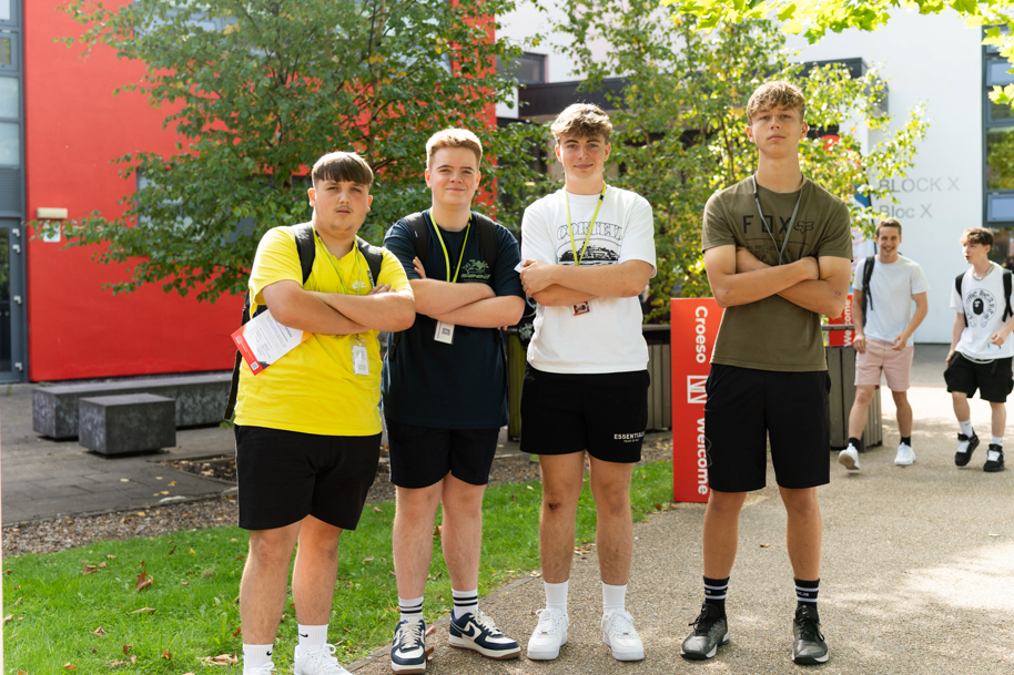 Students at Freshers Fair smiling at camera