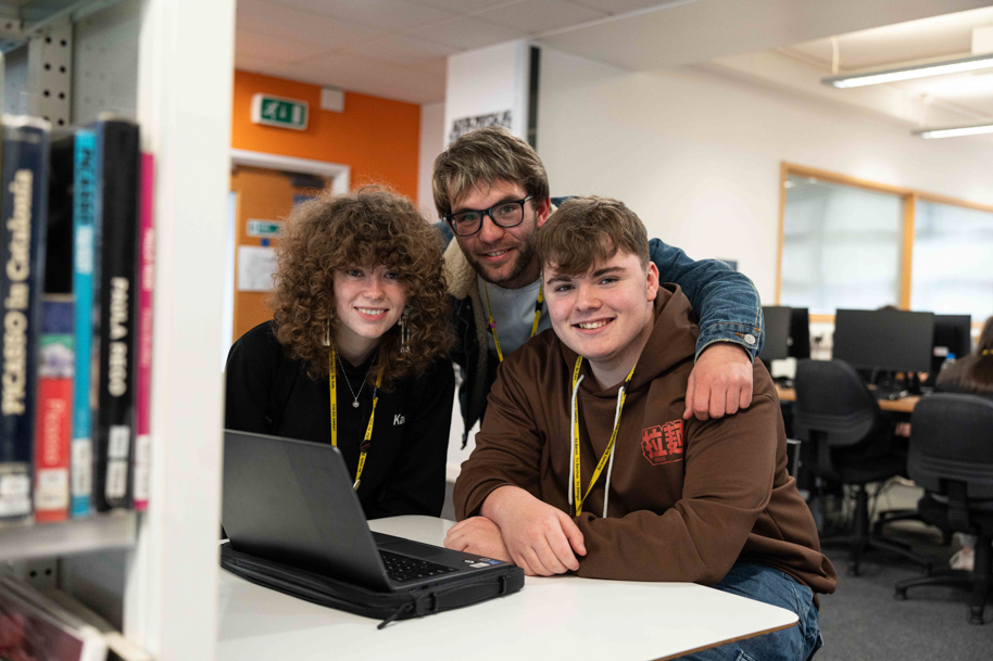 Student laughing together in library