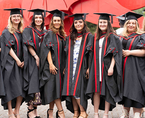Group of Coleg Gwent graduates at graduation ceremony