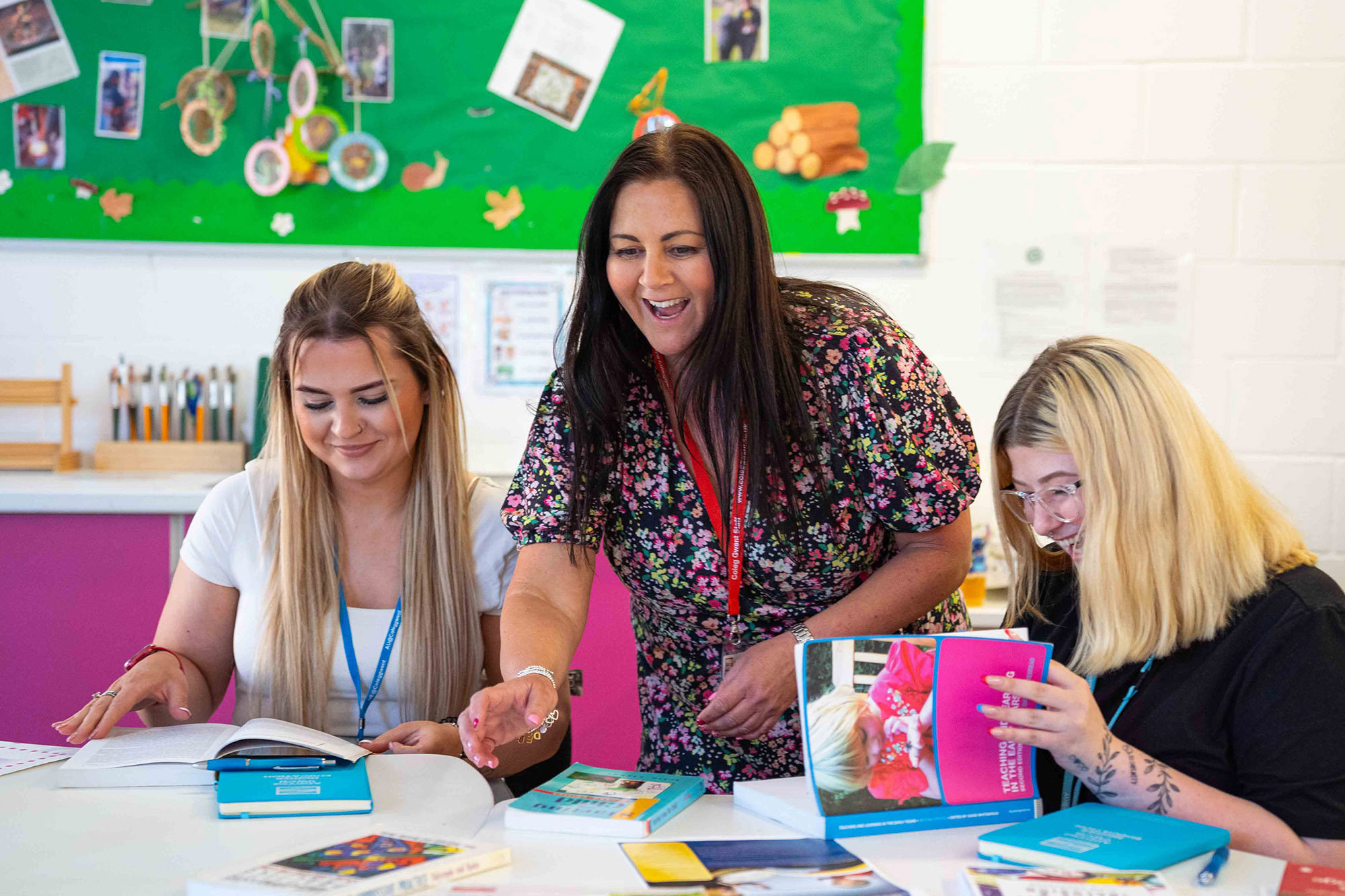 Teacher supporting student and laughing together