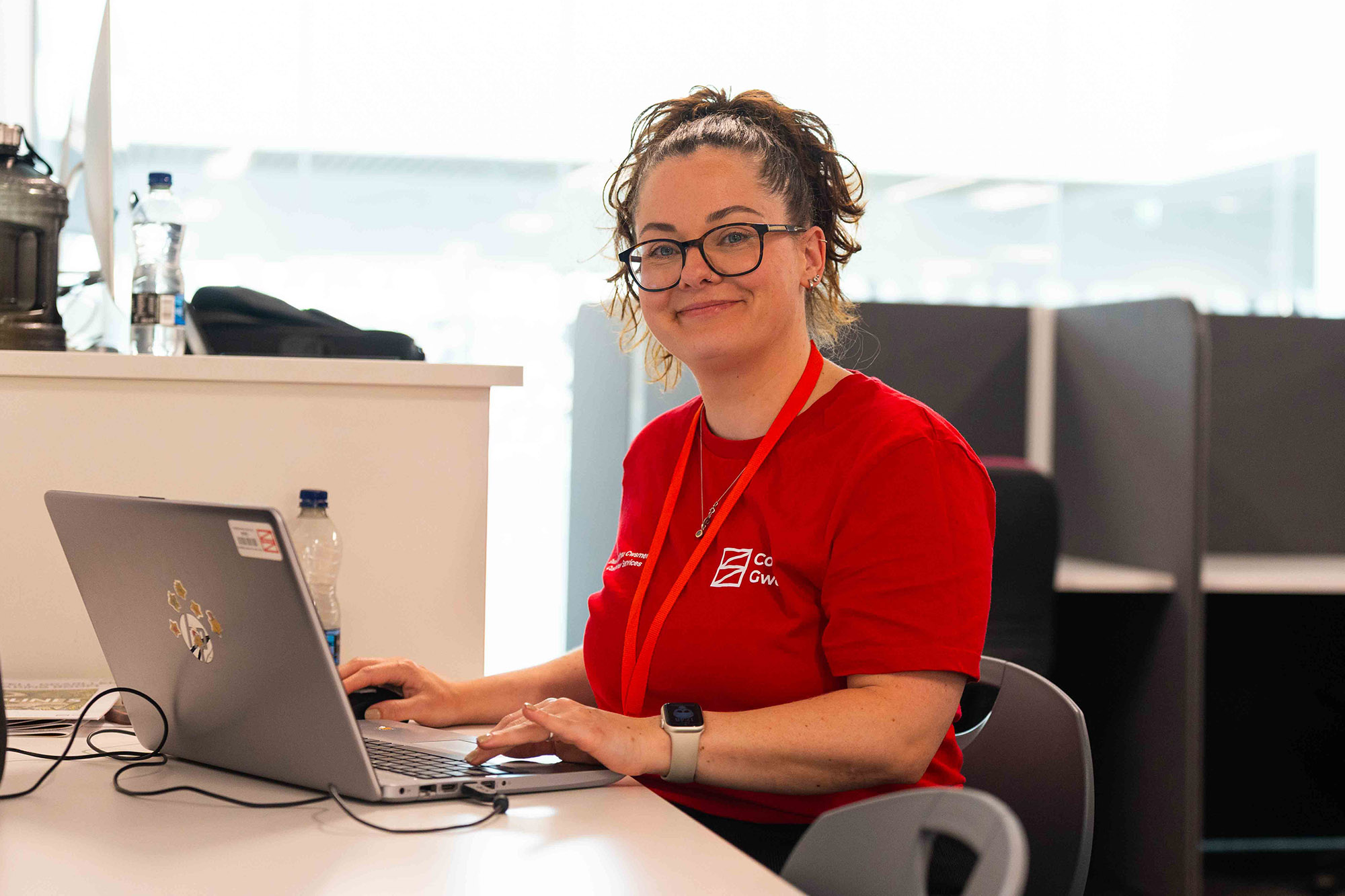 Customer Services staff member smiling