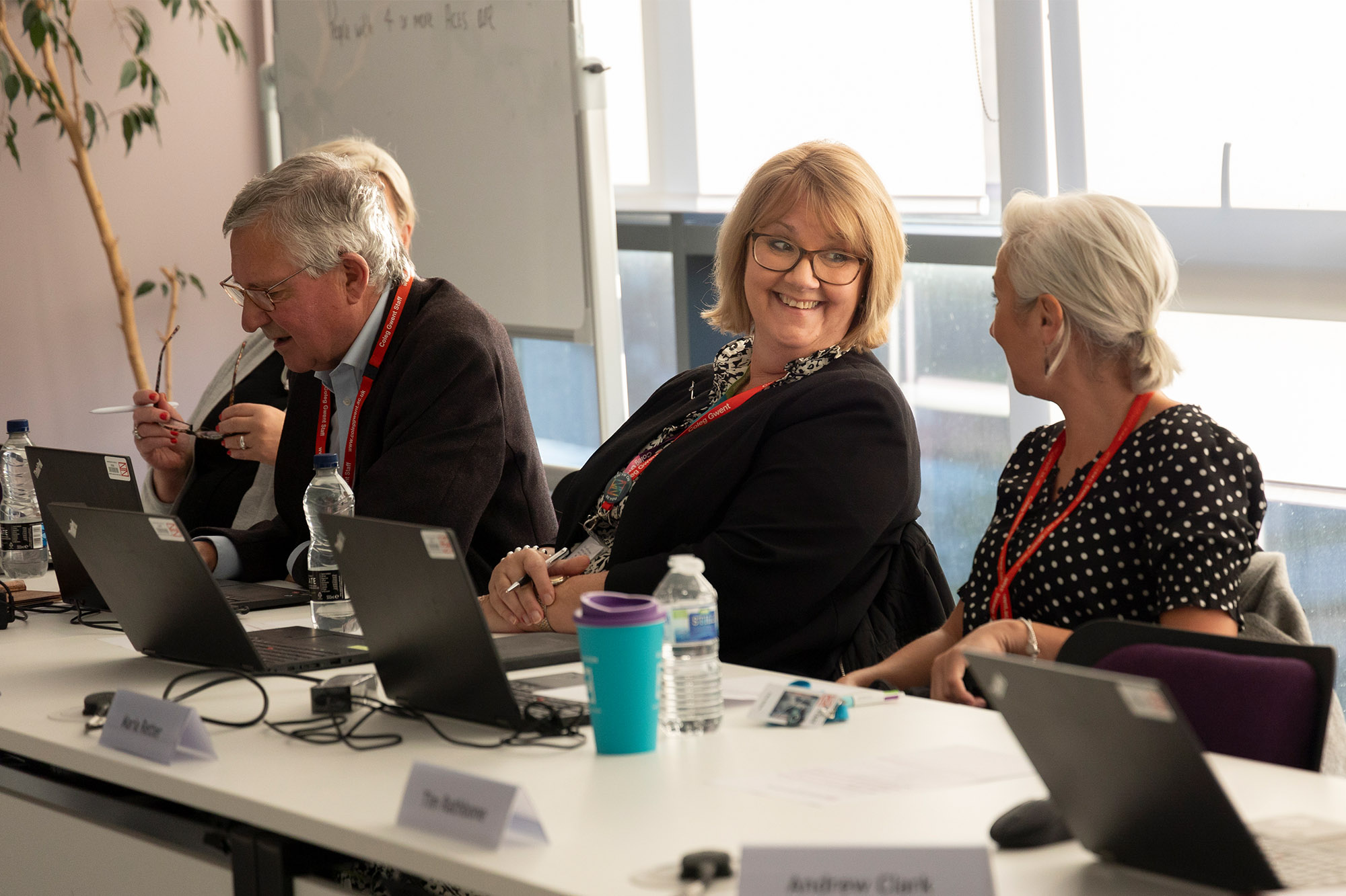 Governors smiling in a meeting