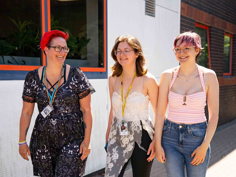 Higher Education students walking with tutor