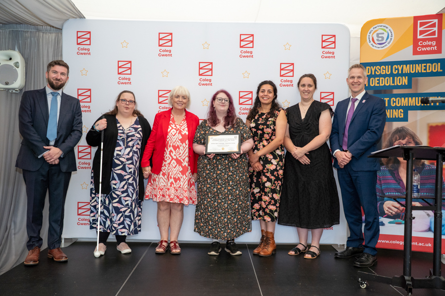 Adult learners receiving an award