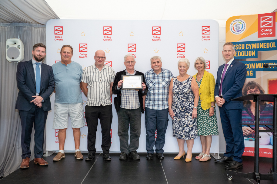 Adult learners receiving an award