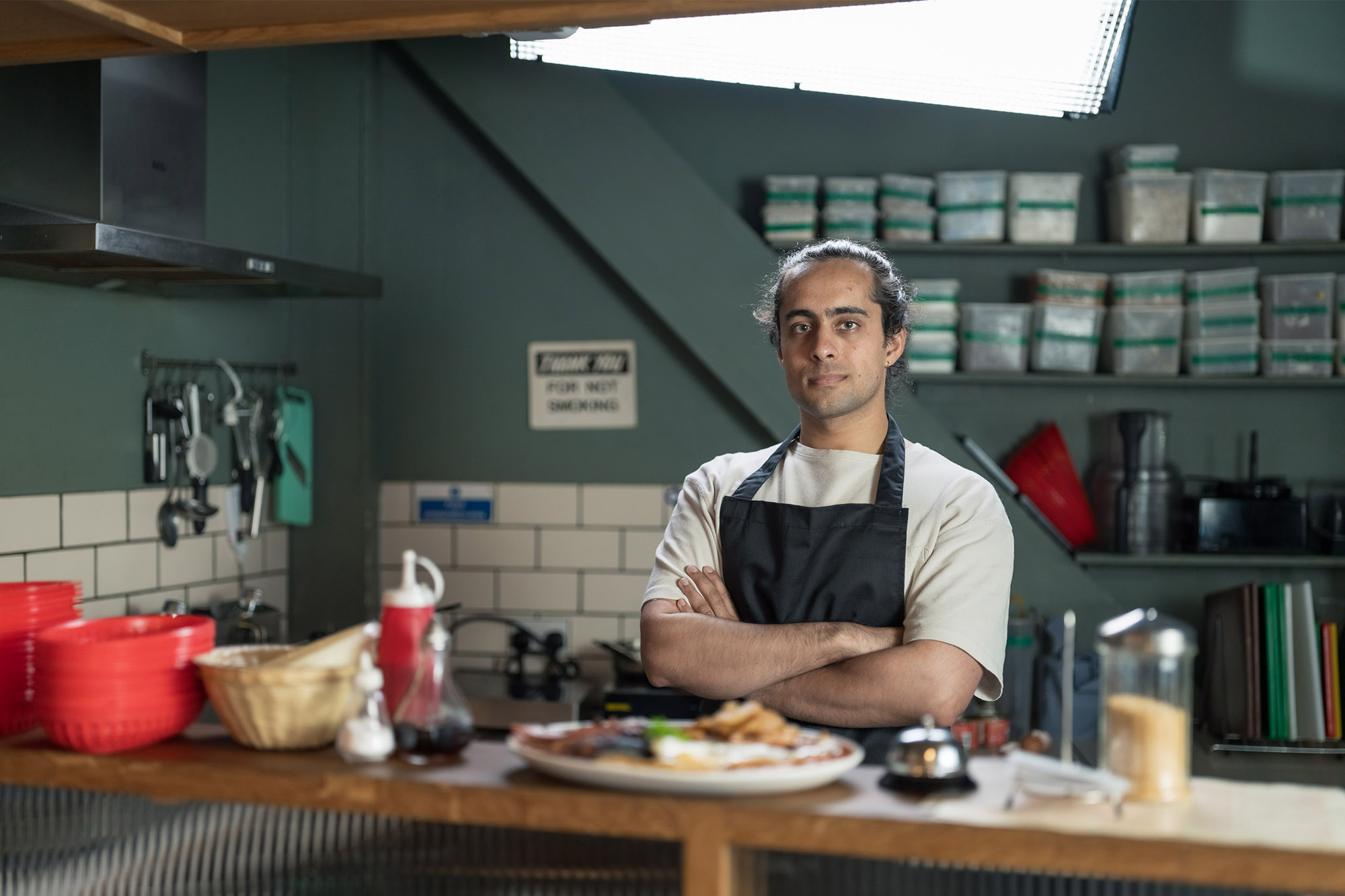 Chef stood in cafe kitchen