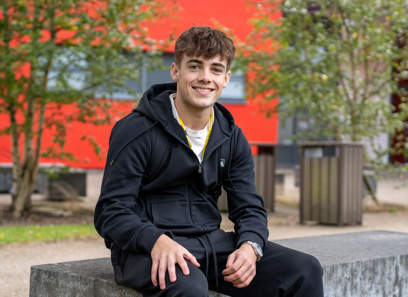 Student sat outside Crosskeys campus