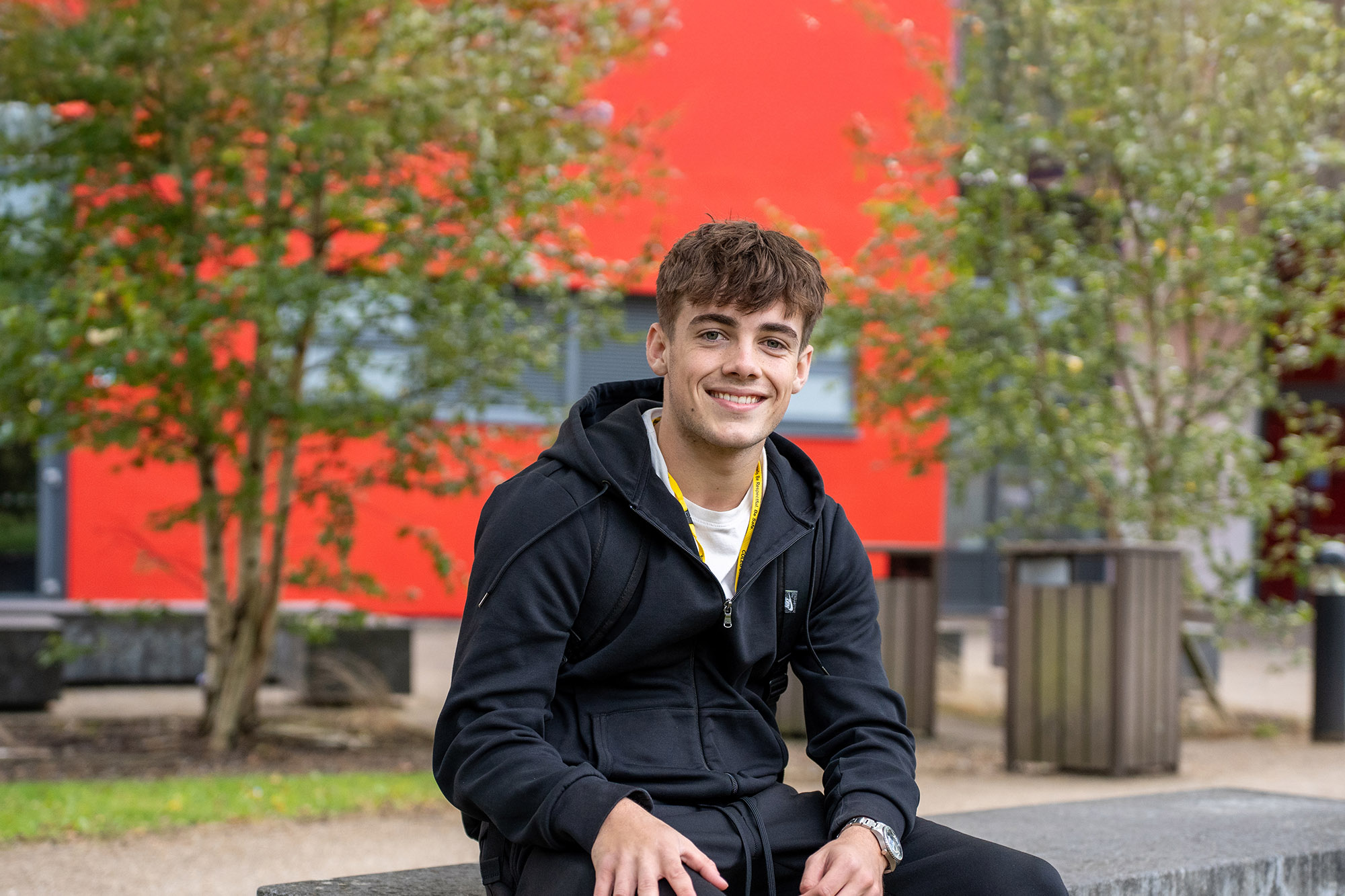Student sat outside Crosskeys campus