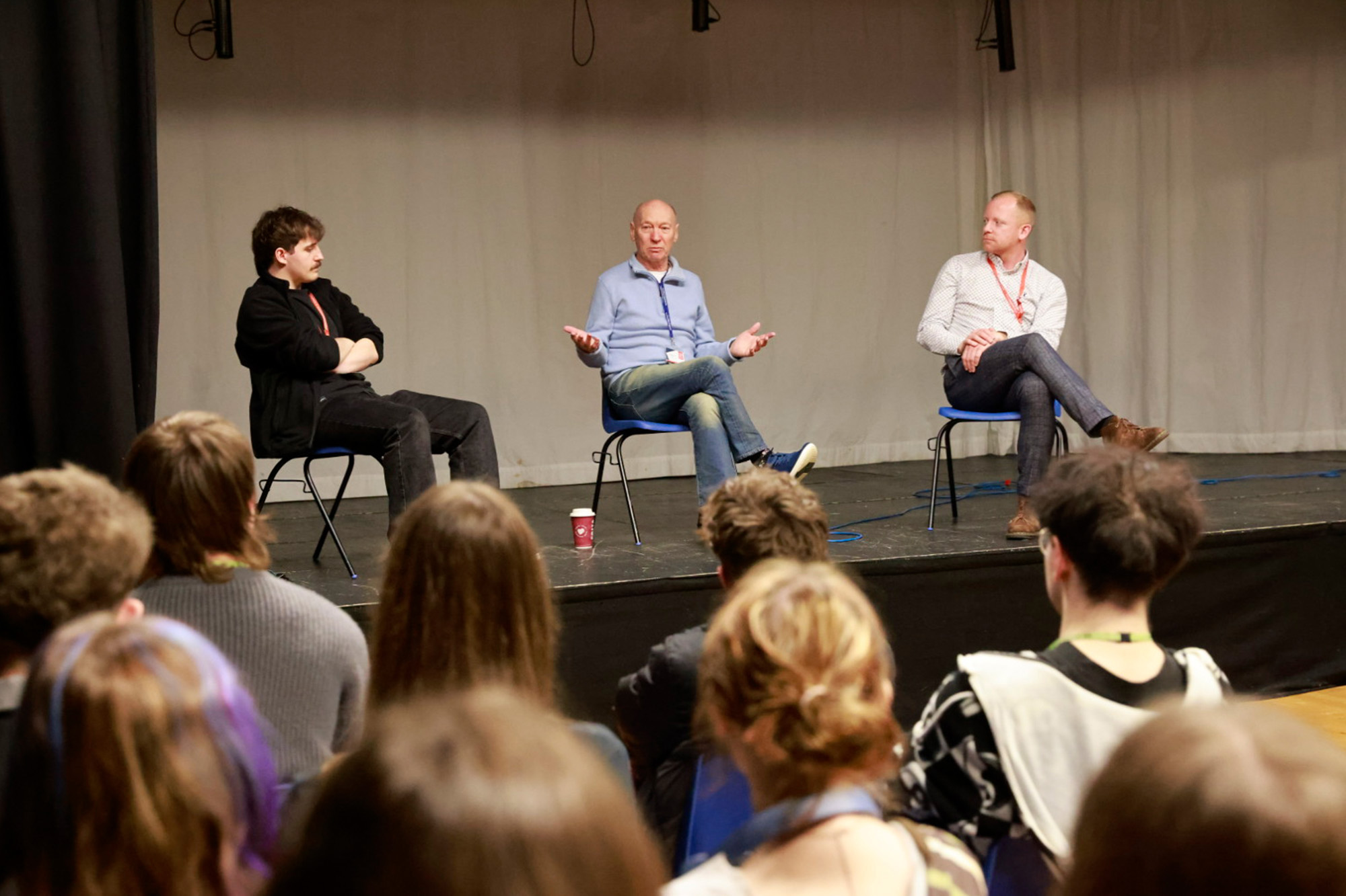 Marcus Russell on stage speaking to students